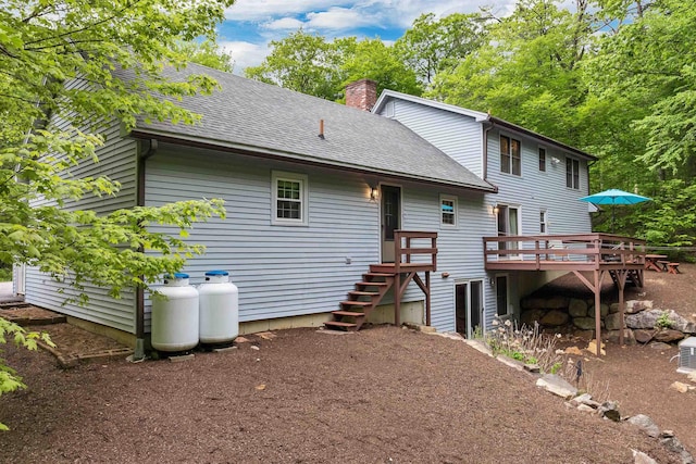 210 Province Rd, Belmont, NH 03220 - rear view of property with a shingled roof, a chimney, a deck, and stairs
