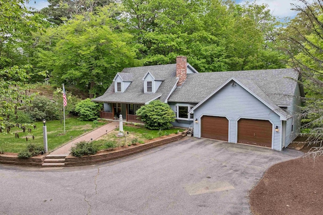 210 Province Rd, Belmont, NH 03220 - view of front facade featuring asphalt driveway, covered porch, a garage, a chimney, and a shingled roof