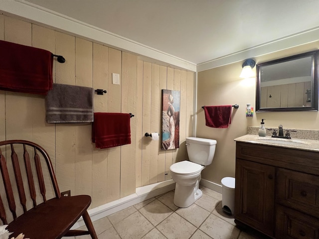 6 Nightingale Ln, Grantham, NH 03753 - bathroom with vanity, toilet, baseboards, and wood walls