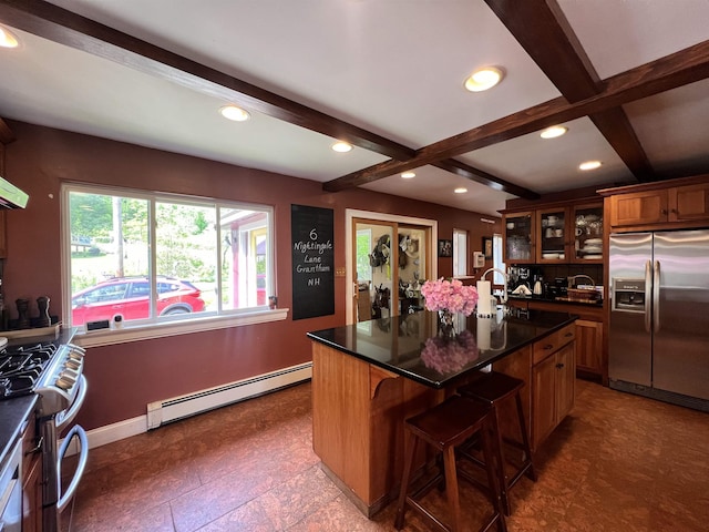 6 Nightingale Ln, Grantham, NH 03753 - kitchen featuring stainless steel appliances, baseboard heating, beam ceiling, glass insert cabinets, and brown cabinetry