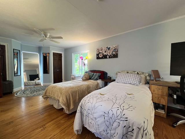 6 Nightingale Ln, Grantham, NH 03753 - bedroom with ornamental molding, wood finished floors, a closet, a ceiling fan, and baseboards
