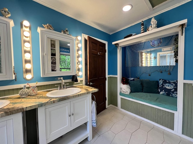 6 Nightingale Ln, Grantham, NH 03753 - bathroom with tile patterned flooring, double vanity, ornamental molding, recessed lighting, and wainscoting
