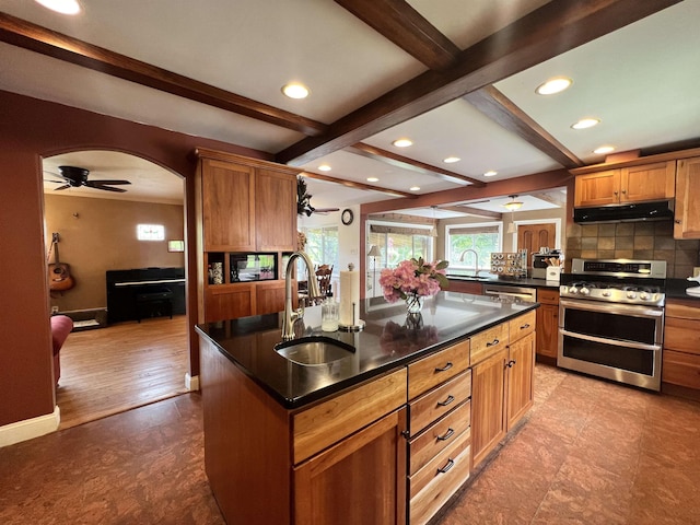 6 Nightingale Ln, Grantham, NH 03753 - kitchen with stainless steel appliances, a sink, under cabinet range hood, beam ceiling, and dark countertops