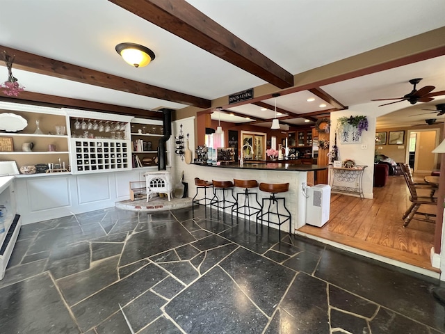 6 Nightingale Ln, Grantham, NH 03753 - living room with a ceiling fan, beamed ceiling, a dry bar, a wood stove, and recessed lighting