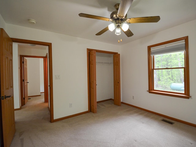 191 Rte 114, Sutton, NH 03221 - unfurnished bedroom featuring light colored carpet, baseboards, a closet, and a ceiling fan