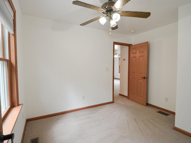 191 Rte 114, Sutton, NH 03221 - empty room featuring a ceiling fan, light colored carpet, baseboards, and a smoke detector
