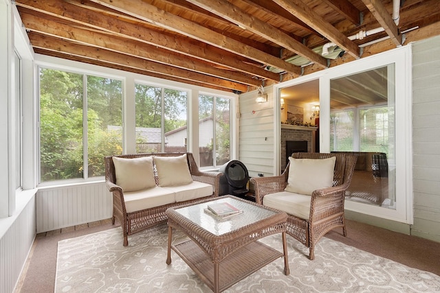 5 Christian Dr, Nashua, NH 03063 - sunroom featuring healthy amount of natural light, radiator, beamed ceiling, and an outdoor hangout area