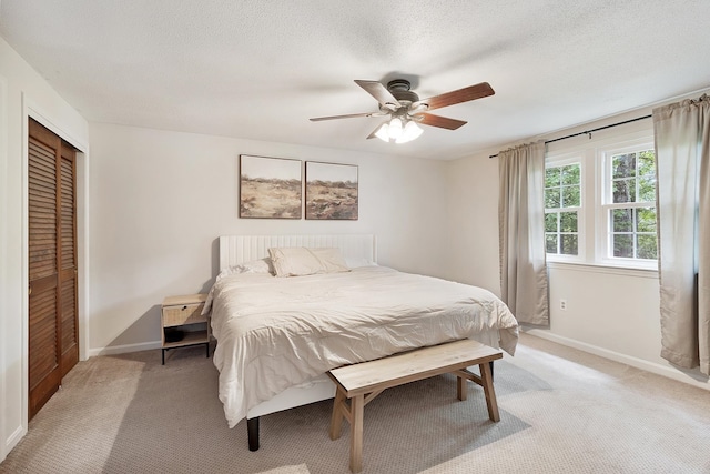 5 Christian Dr, Nashua, NH 03063 - bedroom featuring light colored carpet, baseboards, a closet, ceiling fan, and a textured ceiling