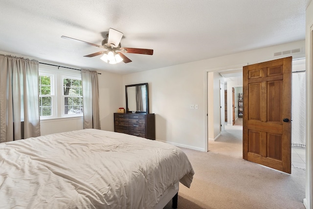 5 Christian Dr, Nashua, NH 03063 - bedroom with light carpet, ceiling fan, baseboards, and a textured ceiling