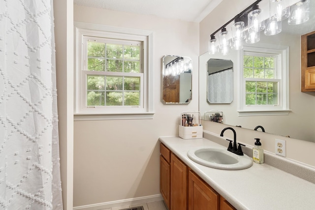 5 Christian Dr, Nashua, NH 03063 - full bath featuring vanity, baseboards, and a shower with shower curtain