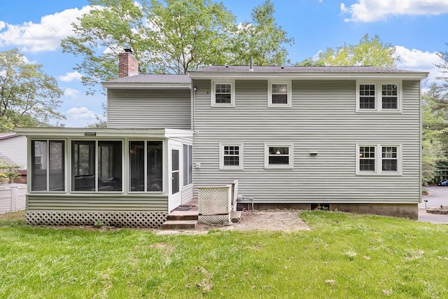 5 Christian Dr, Nashua, NH 03063 - rear view of house featuring a sunroom, a chimney, and a yard