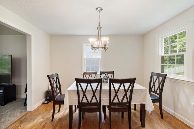 5 Christian Dr, Nashua, NH 03063 - dining space featuring a chandelier, light wood-style flooring, and baseboards