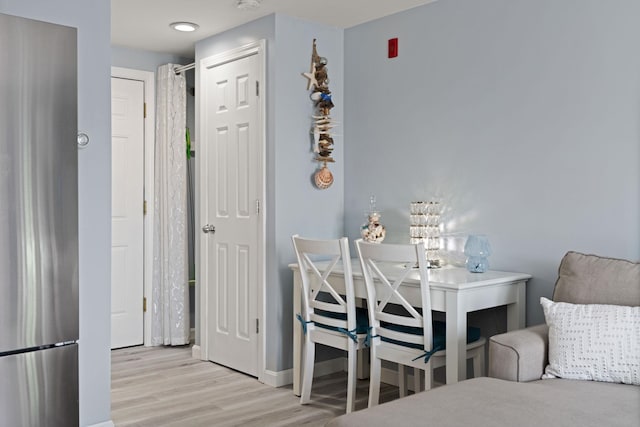 415 Ocean Blvd Unit 2B, Hampton, NH 03842 - bedroom with light wood finished floors, freestanding refrigerator, and baseboards