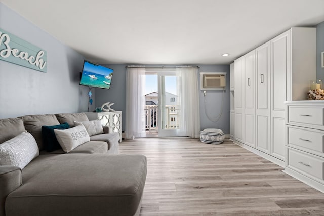 415 Ocean Blvd Unit 2B, Hampton, NH 03842 - living room featuring light wood-style flooring, a wall unit AC, and recessed lighting