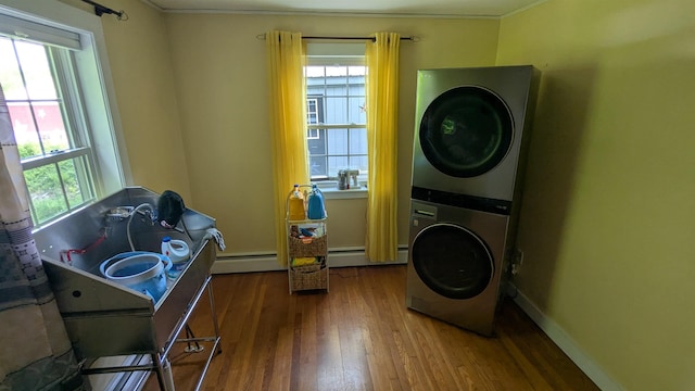 144 Bradford Rd, Henniker, NH 03242 - laundry area featuring stacked washer / dryer, hardwood / wood-style flooring, crown molding, plenty of natural light, and baseboards
