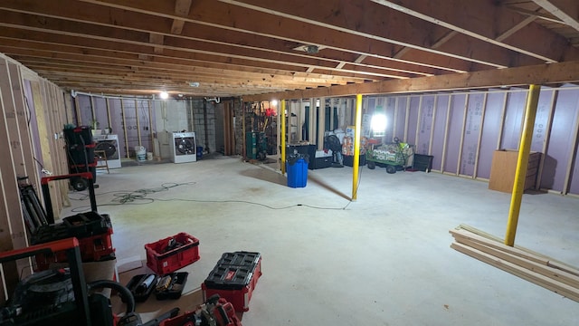 144 Bradford Rd, Henniker, NH 03242 - unfinished below grade area featuring gas water heater and washer / dryer