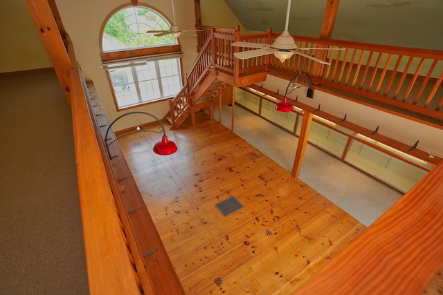 106 Jenkins Rd, Bedford, NH 03110 - staircase featuring ceiling fan, baseboards, and vaulted ceiling