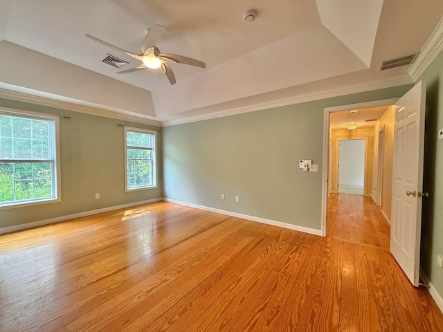 106 Jenkins Rd, Bedford, NH 03110 - empty room with a tray ceiling, crown molding, ceiling fan, light wood-style flooring, and baseboards
