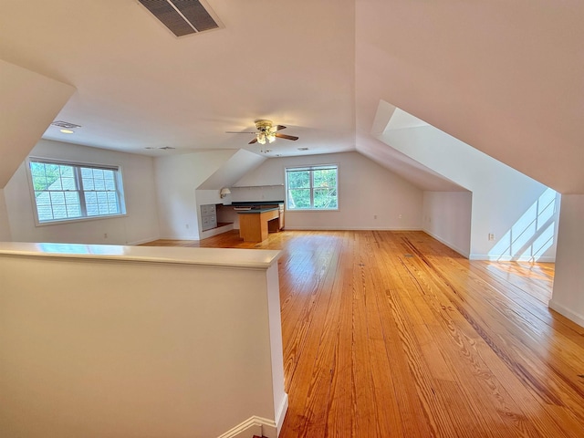 106 Jenkins Rd, Bedford, NH 03110 - bonus room with light wood-type flooring, ceiling fan, vaulted ceiling, and baseboards