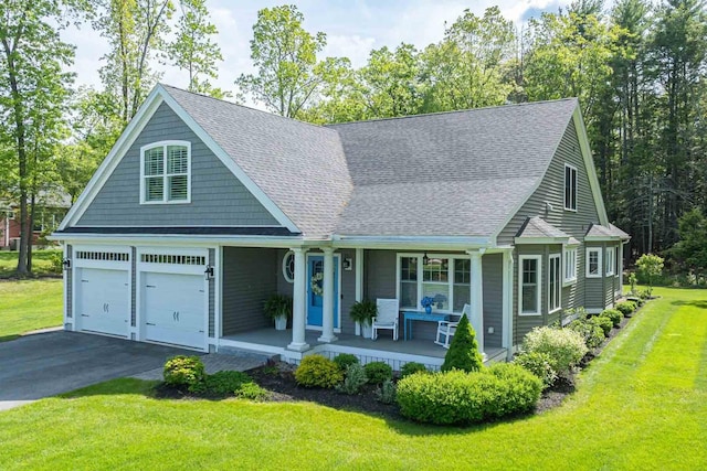 12 Haywick Dr, Stratham, NH 03870 - view of front of property featuring covered porch, a shingled roof, driveway, and a front lawn