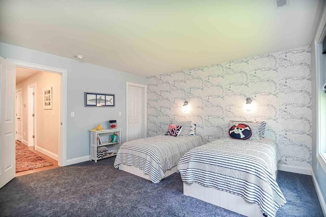 12 Haywick Dr, Stratham, NH 03870 - carpeted bedroom featuring wallpapered walls, an accent wall, and baseboards