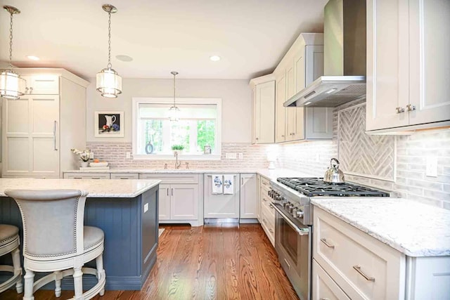 12 Haywick Dr, Stratham, NH 03870 - kitchen with wall chimney range hood, stainless steel range, a sink, dark wood finished floors, and white cabinets
