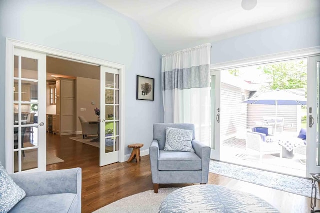12 Haywick Dr, Stratham, NH 03870 - living area featuring french doors, vaulted ceiling, and wood finished floors
