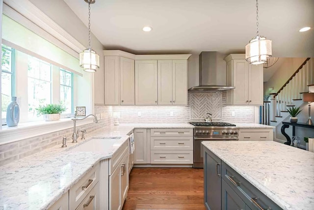 12 Haywick Dr, Stratham, NH 03870 - kitchen with wall chimney exhaust hood, stainless steel range, a sink, tasteful backsplash, and light stone counters