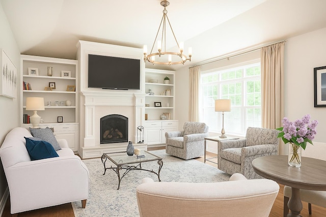 12 Haywick Dr, Stratham, NH 03870 - living room with a chandelier, a fireplace with raised hearth, wood finished floors, and built in features