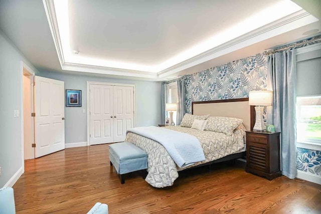 12 Haywick Dr, Stratham, NH 03870 - bedroom with a raised ceiling, wood finished floors, baseboards, a closet, and crown molding