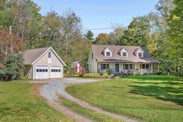 354 Jenny Davis Rd, Waterbury, VT 05676 - cape cod-style house featuring a porch, an outbuilding, a garage, gravel driveway, and a front yard