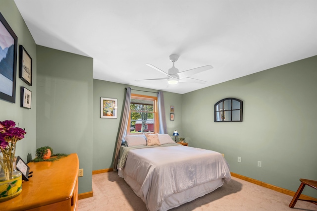 354 Jenny Davis Rd, Waterbury, VT 05676 - bedroom with baseboards, light carpet, and ceiling fan