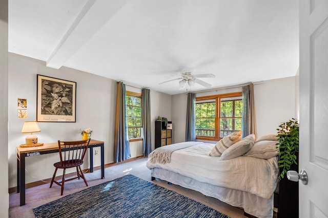 354 Jenny Davis Rd, Waterbury, VT 05676 - bedroom featuring multiple windows, carpet floors, baseboards, and beamed ceiling