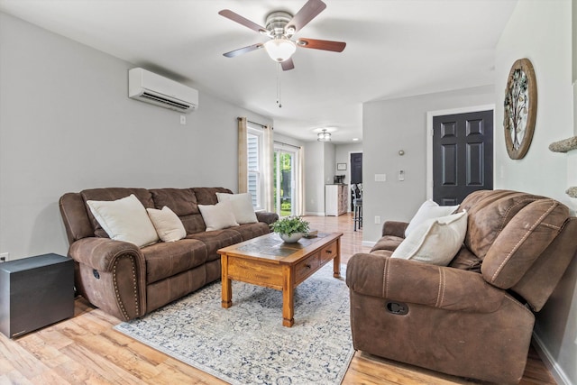 16 Ches Mae Ln, Milford, NH 03055 - living room featuring an AC wall unit, a ceiling fan, and light wood-style floors