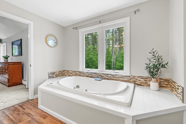 16 Ches Mae Ln, Milford, NH 03055 - full bathroom featuring a tub with jets, wood finished floors, and baseboards