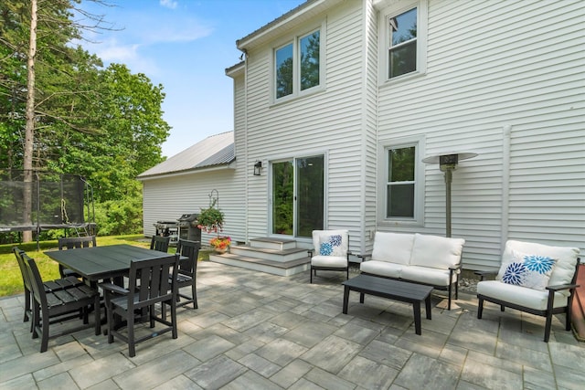 16 Ches Mae Ln, Milford, NH 03055 - view of patio / terrace with an outdoor hangout area, a trampoline, and outdoor dining area