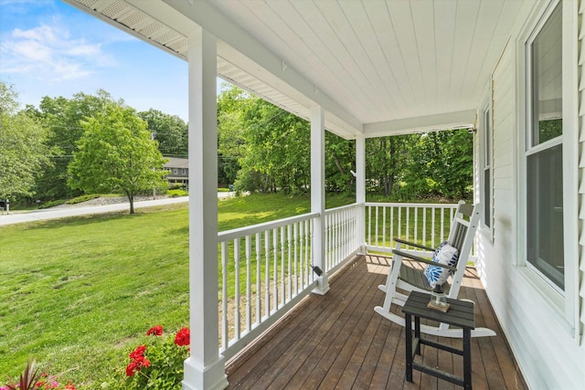 16 Ches Mae Ln, Milford, NH 03055 - wooden porch featuring a lawn and view of wooded area