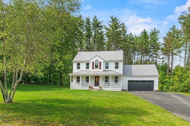 16 Ches Mae Ln, Milford, NH 03055 - view of front facade with covered porch, a garage, asphalt driveway, a chimney, and a front yard