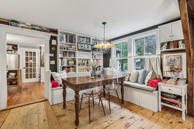 26 Middle St, Amherst, NH 03031 - dining space with light wood-style floors and a chandelier