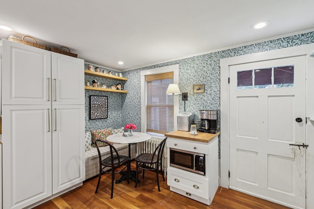 26 Middle St, Amherst, NH 03031 - kitchen with wallpapered walls, stainless steel microwave, wood finished floors, wooden counters, and open shelves