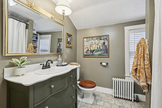 26 Middle St, Amherst, NH 03031 - bathroom with radiator heating unit, vanity, toilet, lofted ceiling, and baseboards