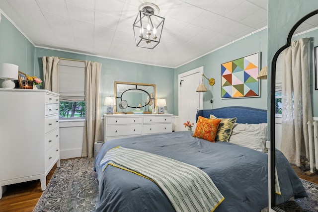 26 Middle St, Amherst, NH 03031 - bedroom with crown molding, wood finished floors, and a chandelier