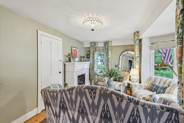 26 Middle St, Amherst, NH 03031 - living area featuring light wood-style flooring, a fireplace, and baseboards