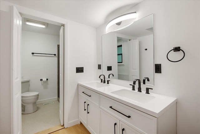 135 Governor Peck Rd, Jericho, VT 05465 - full bathroom with double vanity, toilet, and baseboards