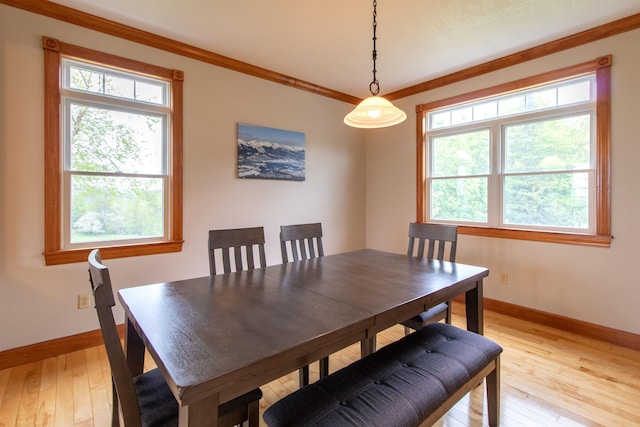 275 Petit Rd, Coventry, VT 05825 - dining room with baseboards, light wood finished floors, and ornamental molding