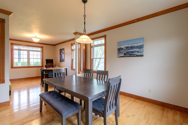 275 Petit Rd, Coventry, VT 05825 - dining room featuring healthy amount of natural light, crown molding, light wood-style floors, and baseboards