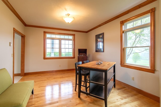 275 Petit Rd, Coventry, VT 05825 - dining room with healthy amount of natural light, light wood-style flooring, ornamental molding, and baseboards
