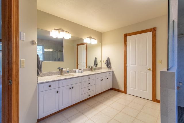 275 Petit Rd, Coventry, VT 05825 - bathroom with double vanity, tile patterned floors, and baseboards