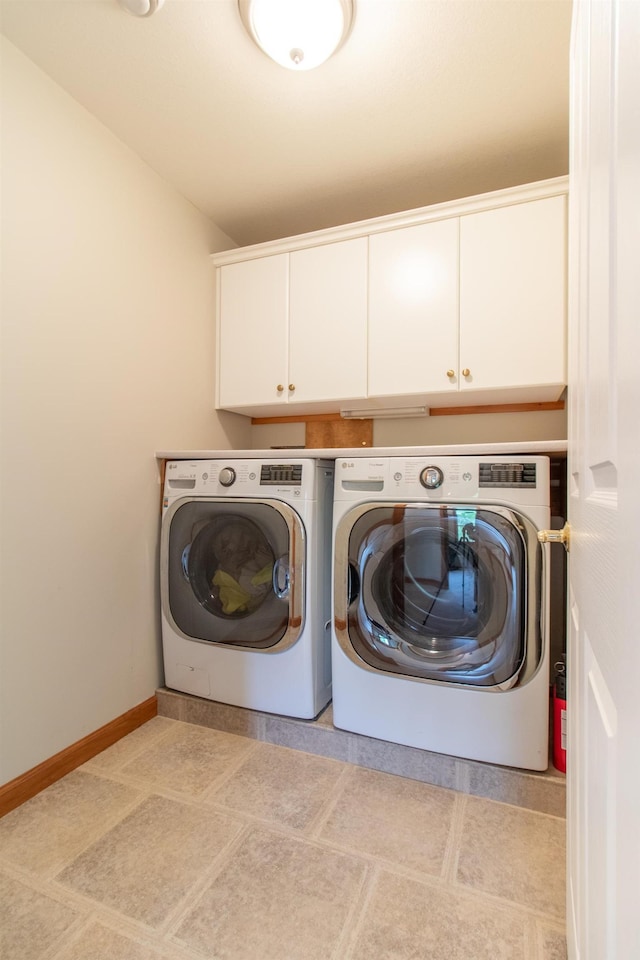275 Petit Rd, Coventry, VT 05825 - laundry area featuring cabinet space, washing machine and clothes dryer, and baseboards