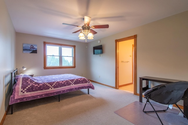 275 Petit Rd, Coventry, VT 05825 - bedroom featuring light carpet, baseboards, a ceiling fan, and connected bathroom